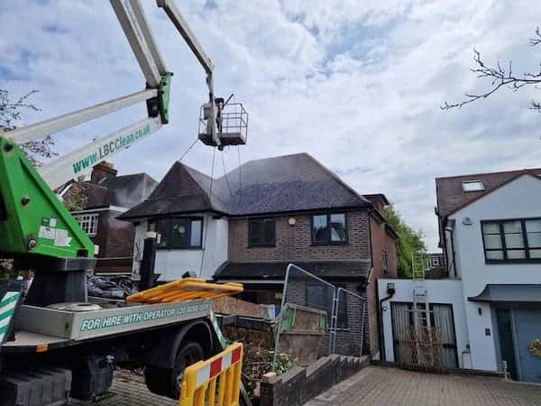a crane lifting a roof